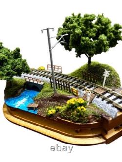 N gauge model train layout with landscape kato #bfb55c
